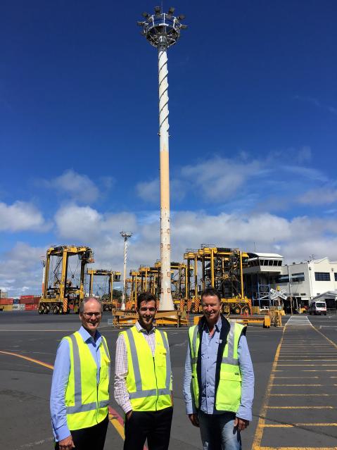 Men standing by tower